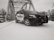 Police Cruiser by 3rd Street Bridge in winter